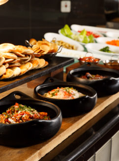 Bowls of curry, rice and naan bread at meetings buffet