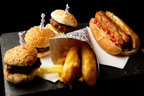 close up of burger sliders, fish fingers and mini hotdog