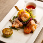 Salmon and prawn kebabs with vegetables and dipping sauce