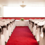 The Ambassador Suite at Mercure Ayr Hotel, set up for a wedding ceremony, red carpet aisle