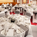 The Windows on the Ocean Room at the Mercure Ayr Hotel set up for a wedding breakfast