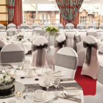 The Windows on the Ocean Room at the Mercure Ayr Hotel set up for a wedding breakfast