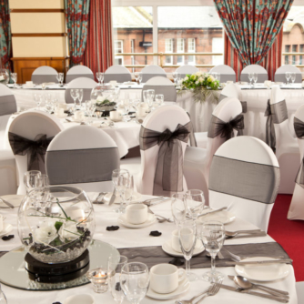 The Windows on the Ocean Room at the Mercure Ayr Hotel set up for a wedding breakfast